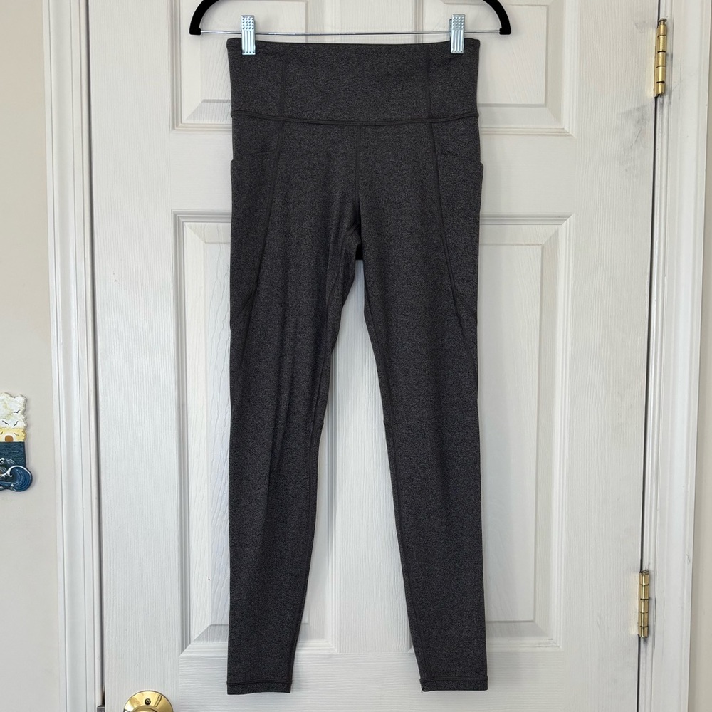 Athleta Stash Pocket Salutation Tight Leggings